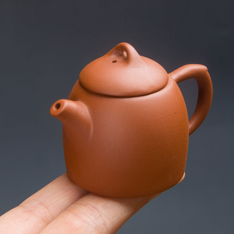 this is a mini zhuni red clay teapot