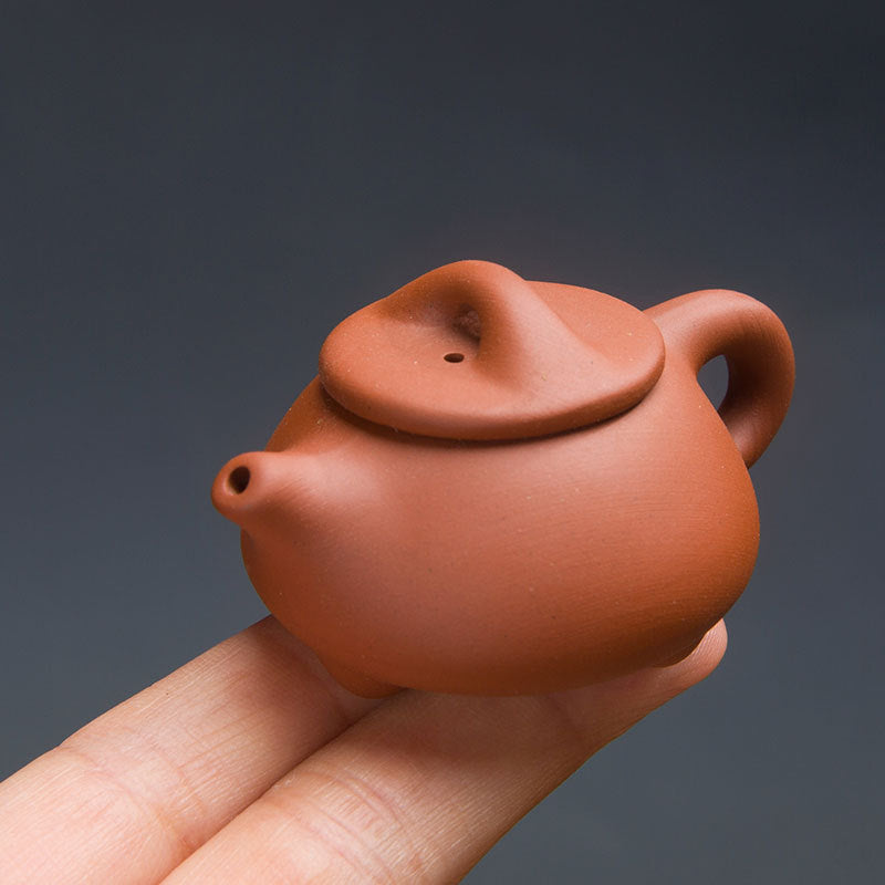 this is a mini zhuni red clay teapot