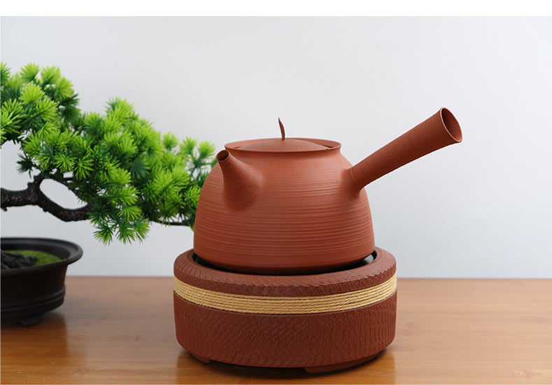 This is a pottery side handle kettle