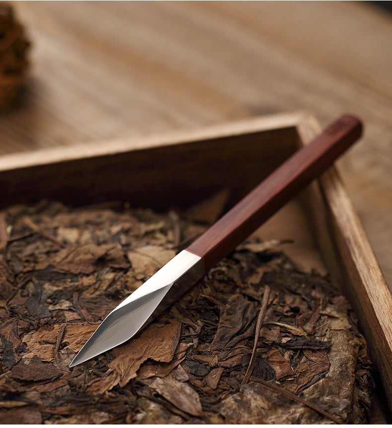 This is a sandalwood puerh cake knife tea knife tea needles