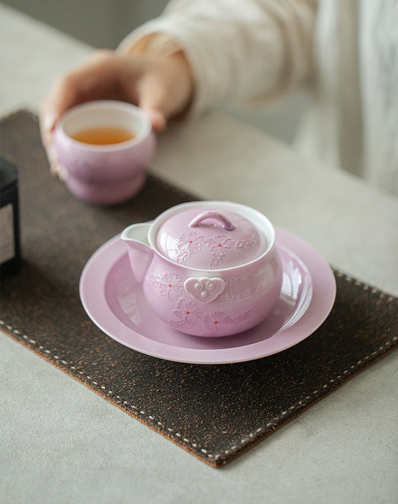 This is a Arita ware teapot. this is a pink ceramic teapot