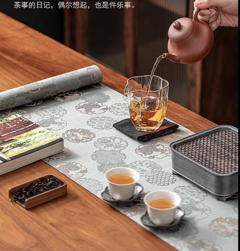 This is a silk brocade tea mat.this is a waterproof table cloth