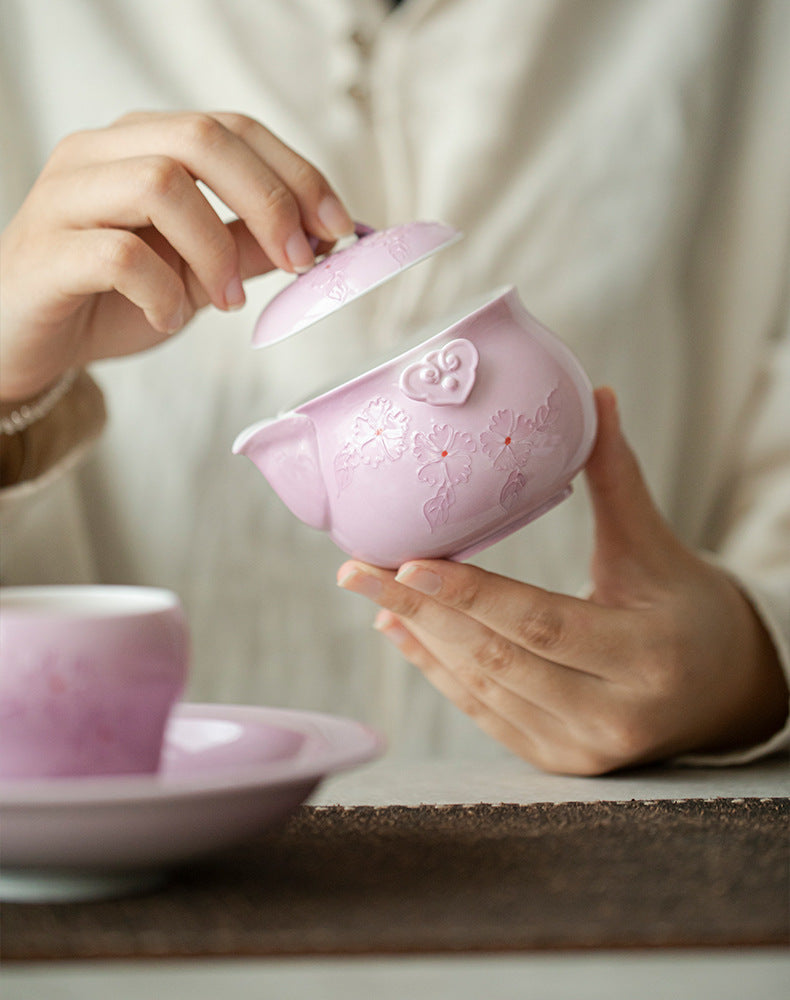 This is a Arita ware teapot. this is a pink ceramic teapot