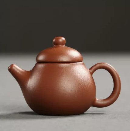 this is a mini zhuni red clay teapot