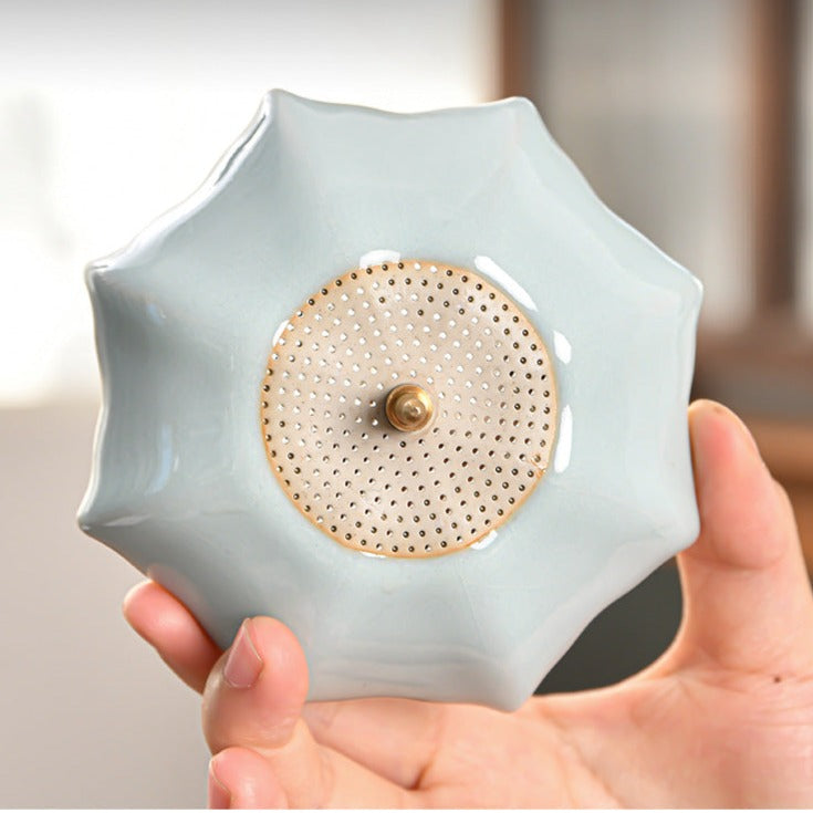 This is a ceramic tea filter tea funnel