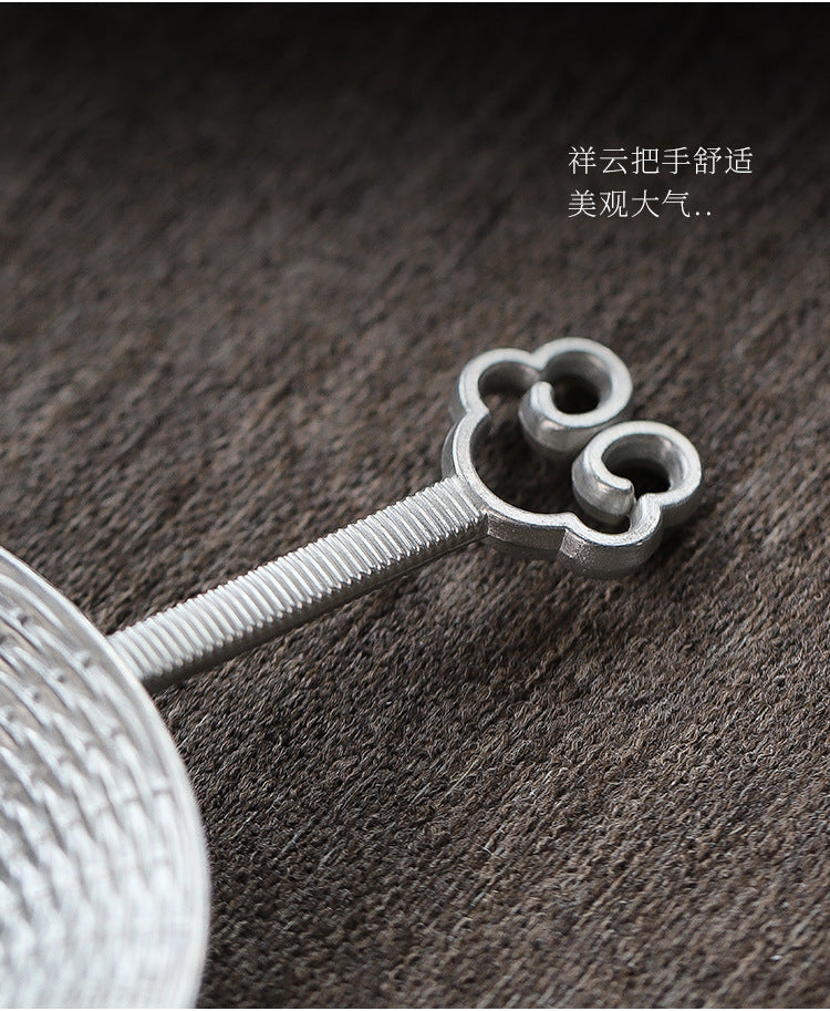 This is a tin tea scoop tea filter