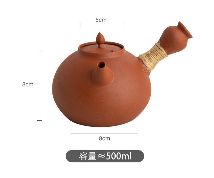 This is a pottery side handle kettle