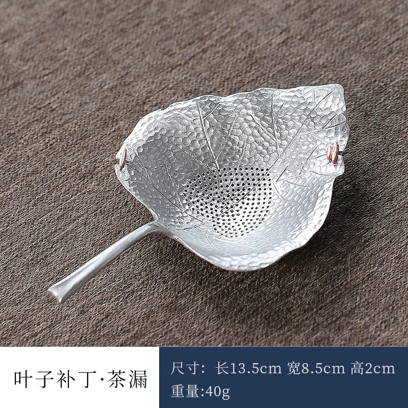 This is a tin tea scoop tea filter