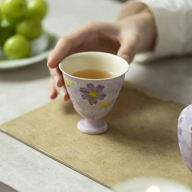 this is a purple ceramic teapot. this is Chinse kohiki teapot