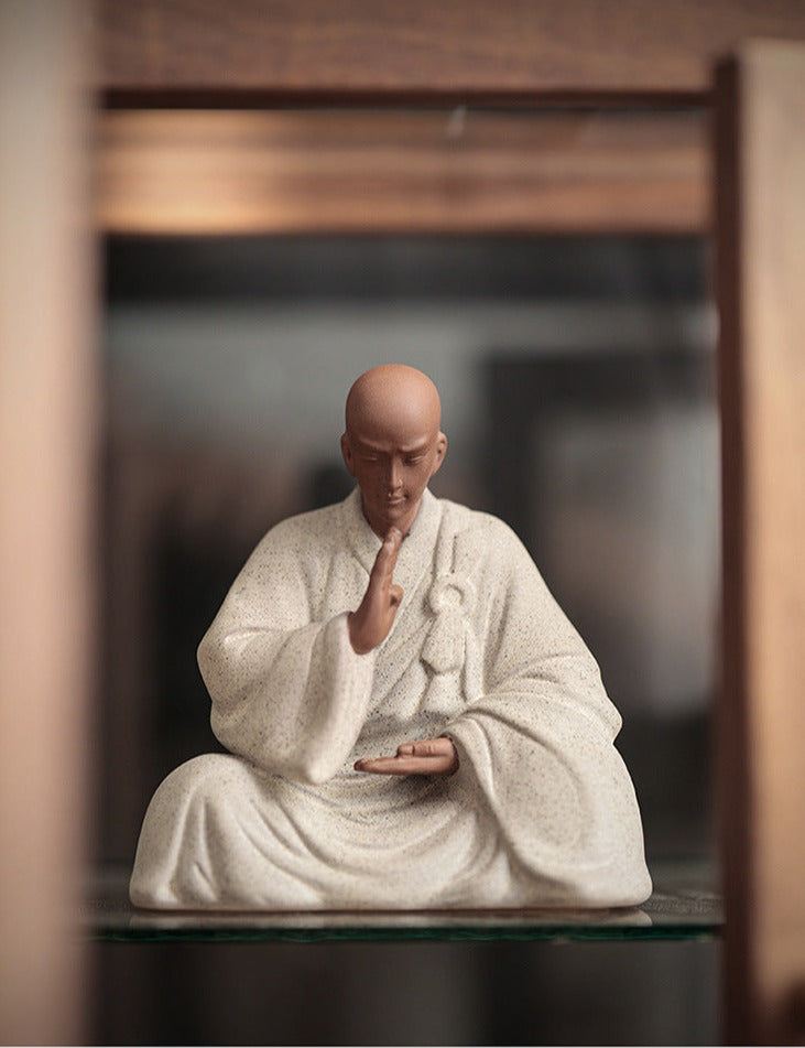 this is a pottery monk sculpture