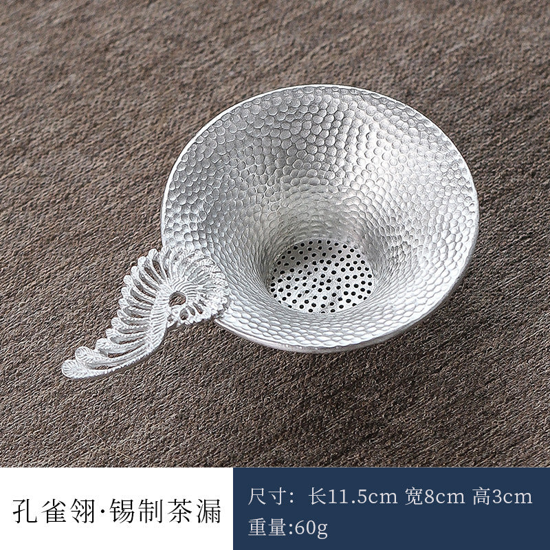 This is a tin tea scoop tea filter