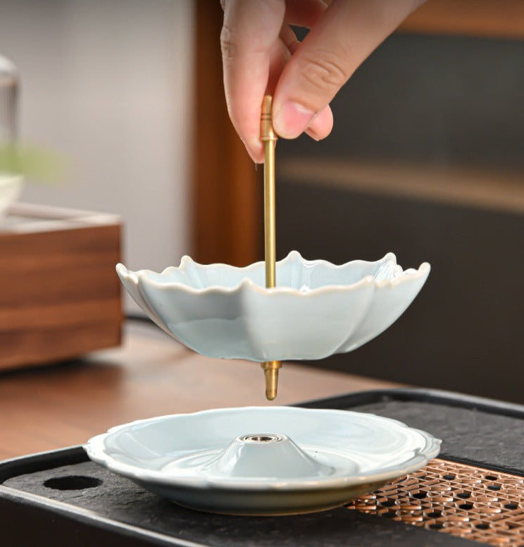 This is a ceramic tea filter tea funnel