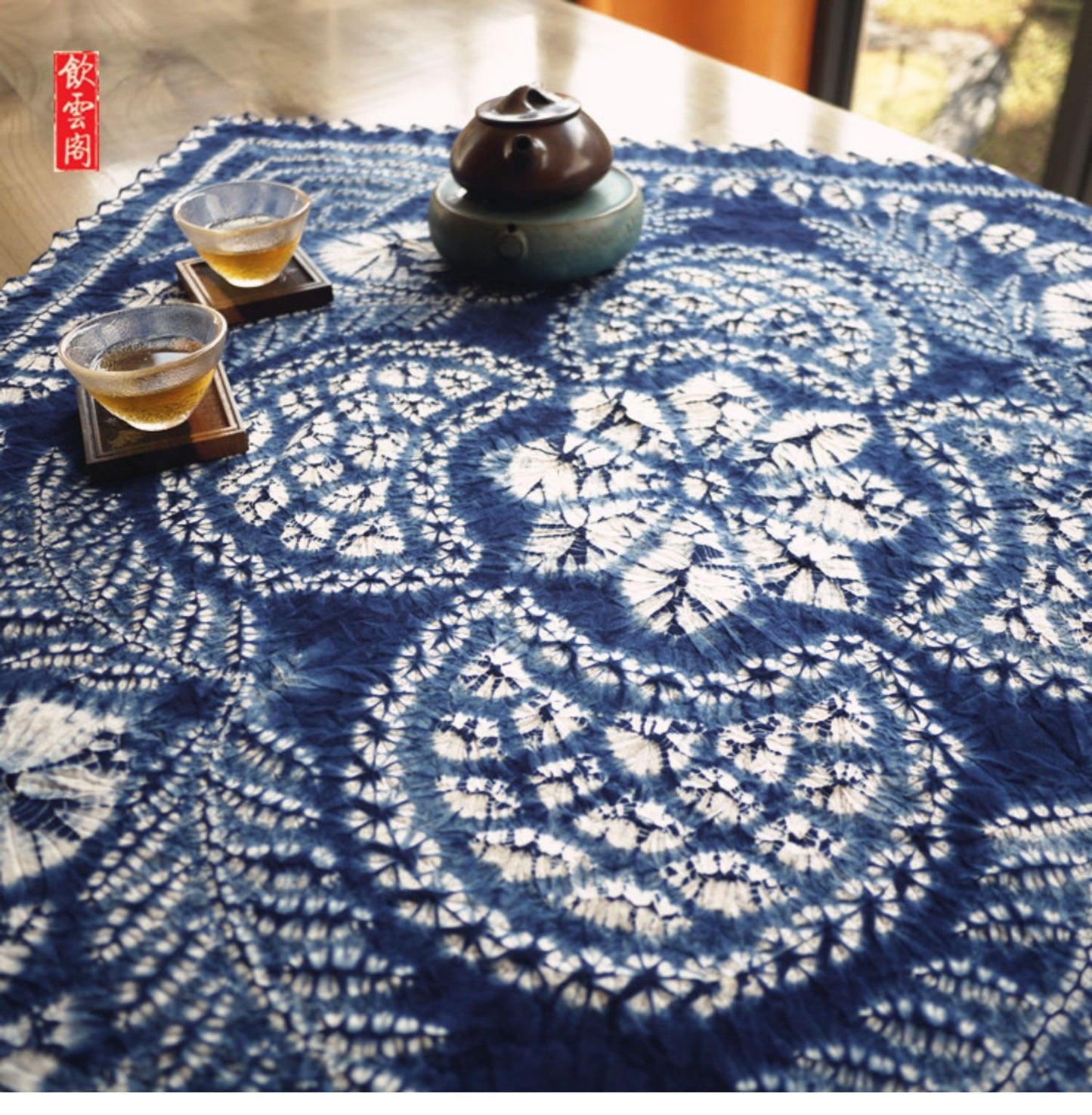 This is a tie-dyed tea mat table cloth