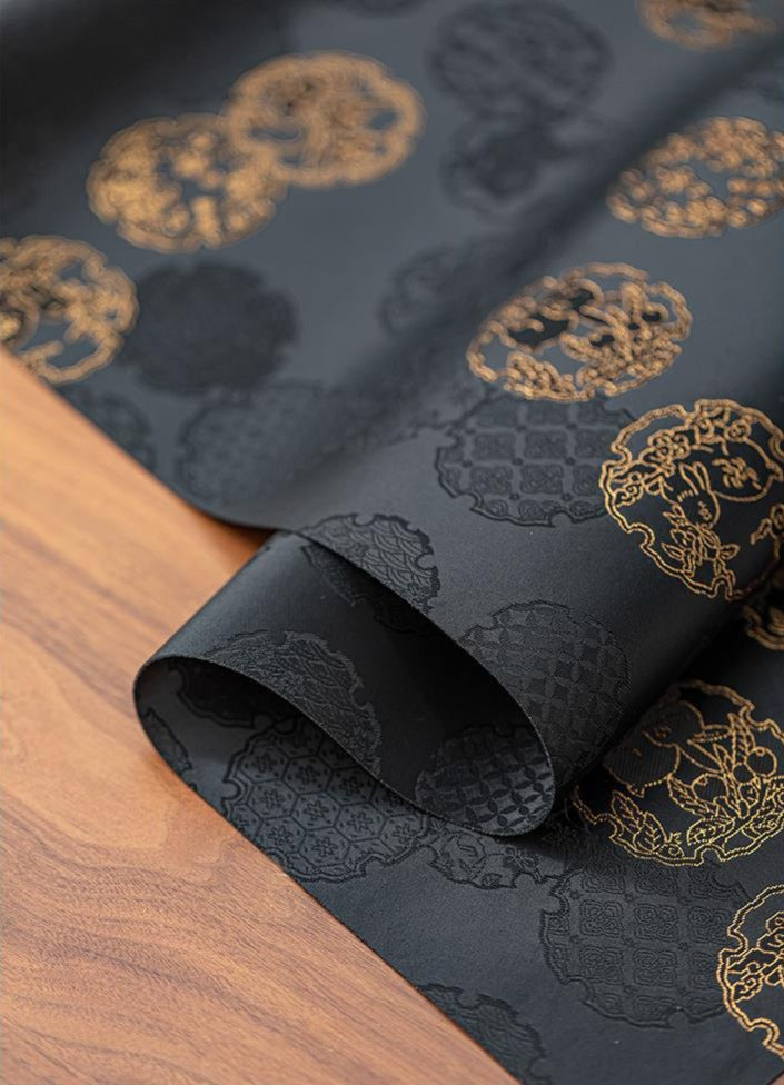 This is a silk brocade tea mat.this is a waterproof table cloth