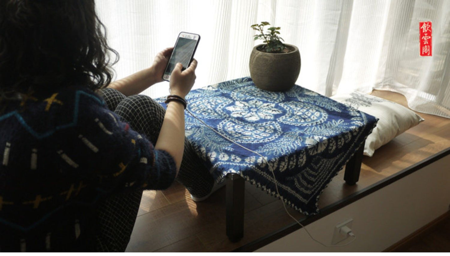 This is a tie-dyed tea mat table cloth