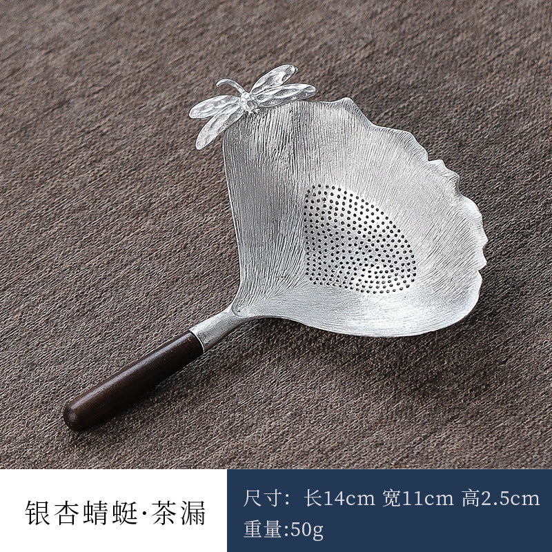 This is a tin tea scoop tea filter