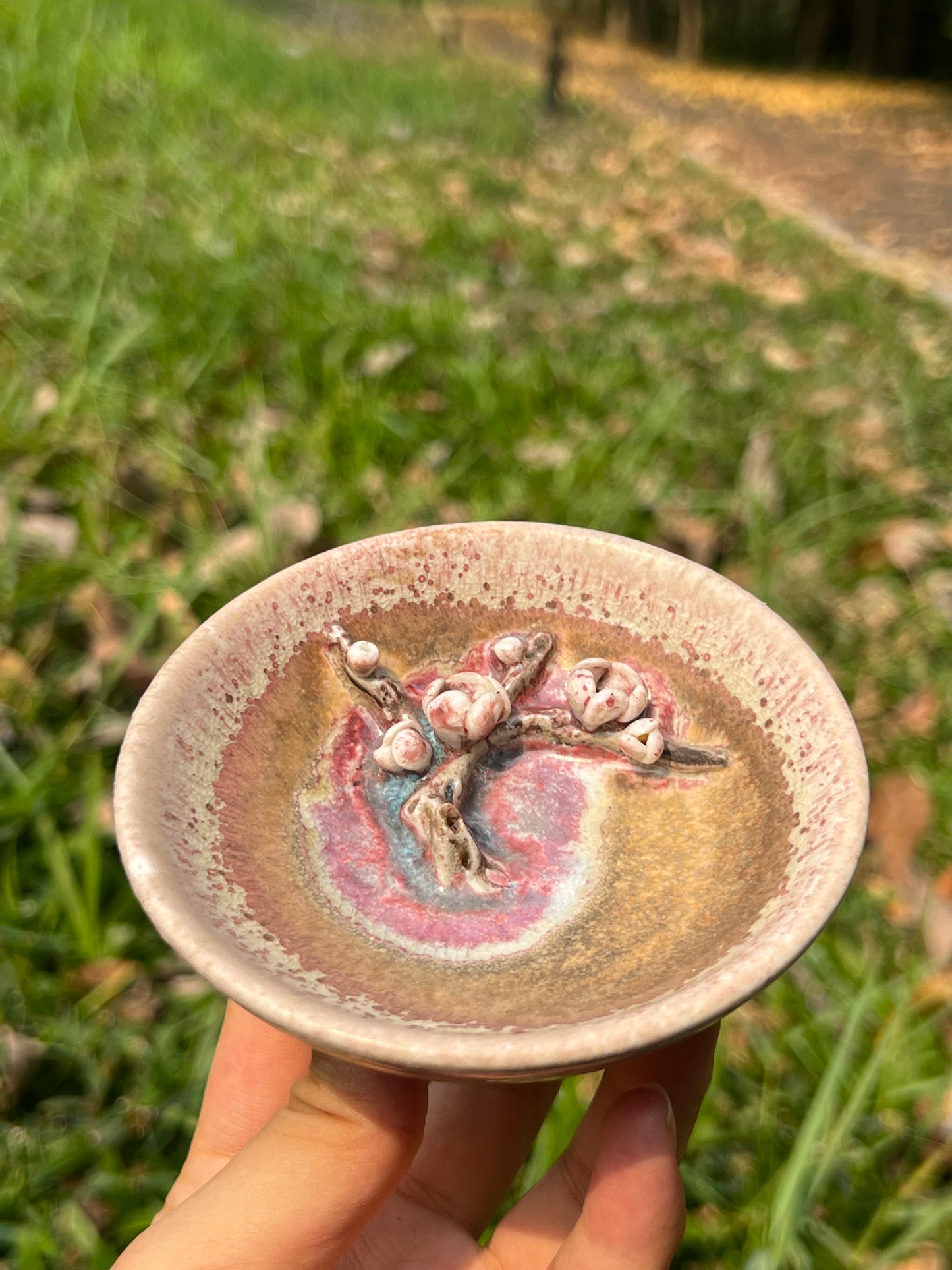 This is a woodfired pottery flower teacup