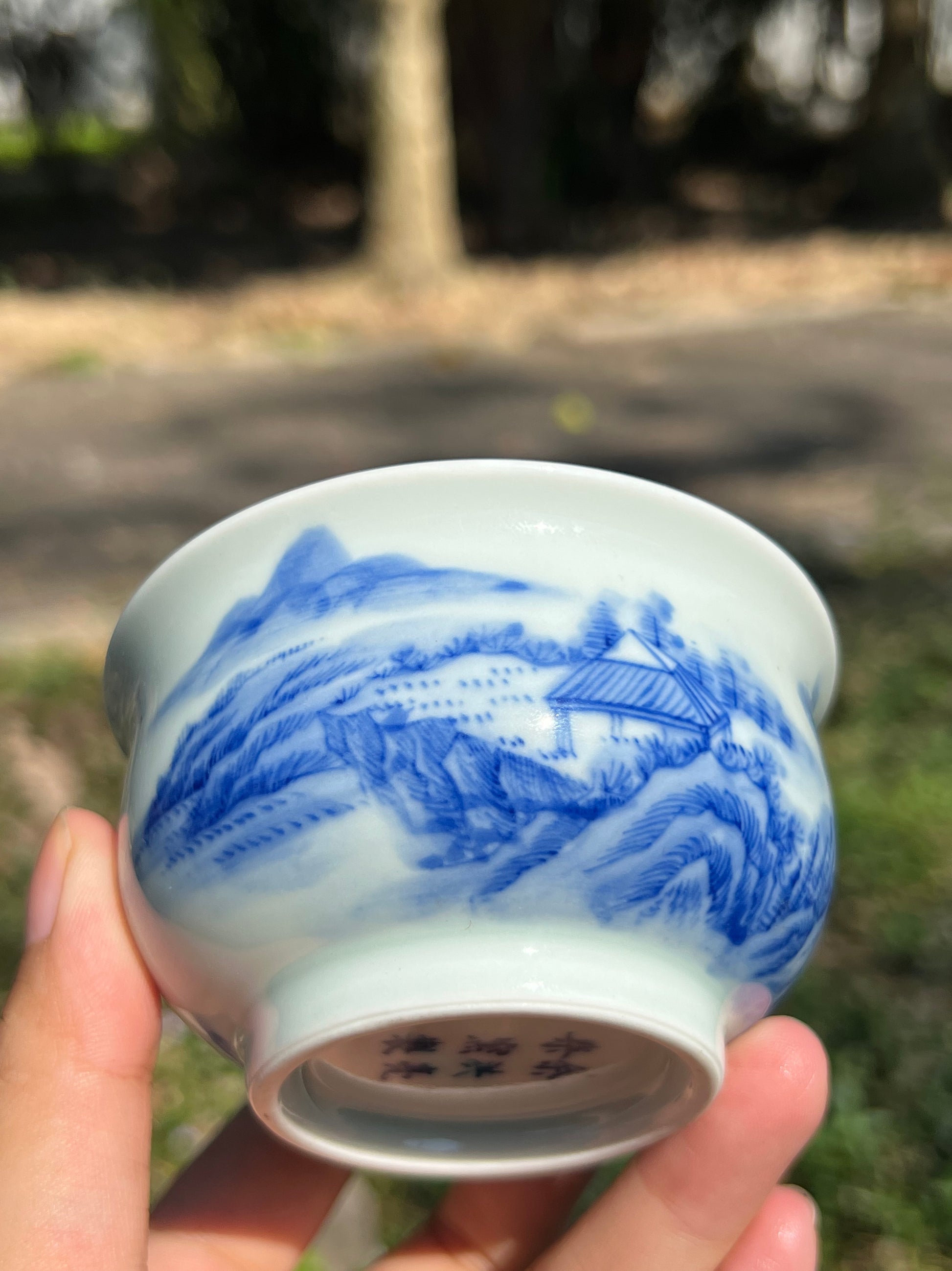 This is a Chinese Jingdezhen blue and white porcelain landscape teacup