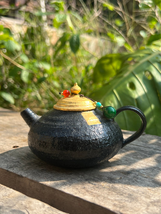 this is Chinese lacquer ware. this is a pottery teapot