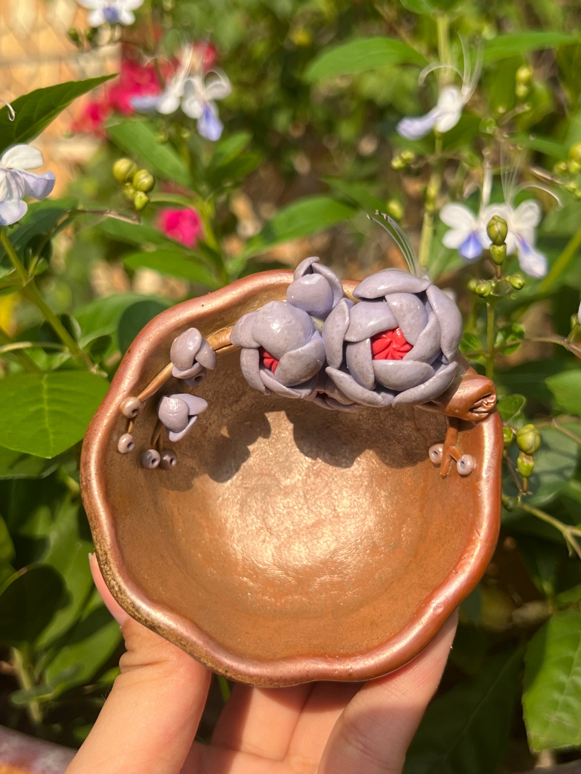 This is a woodfired pottery flower teacup