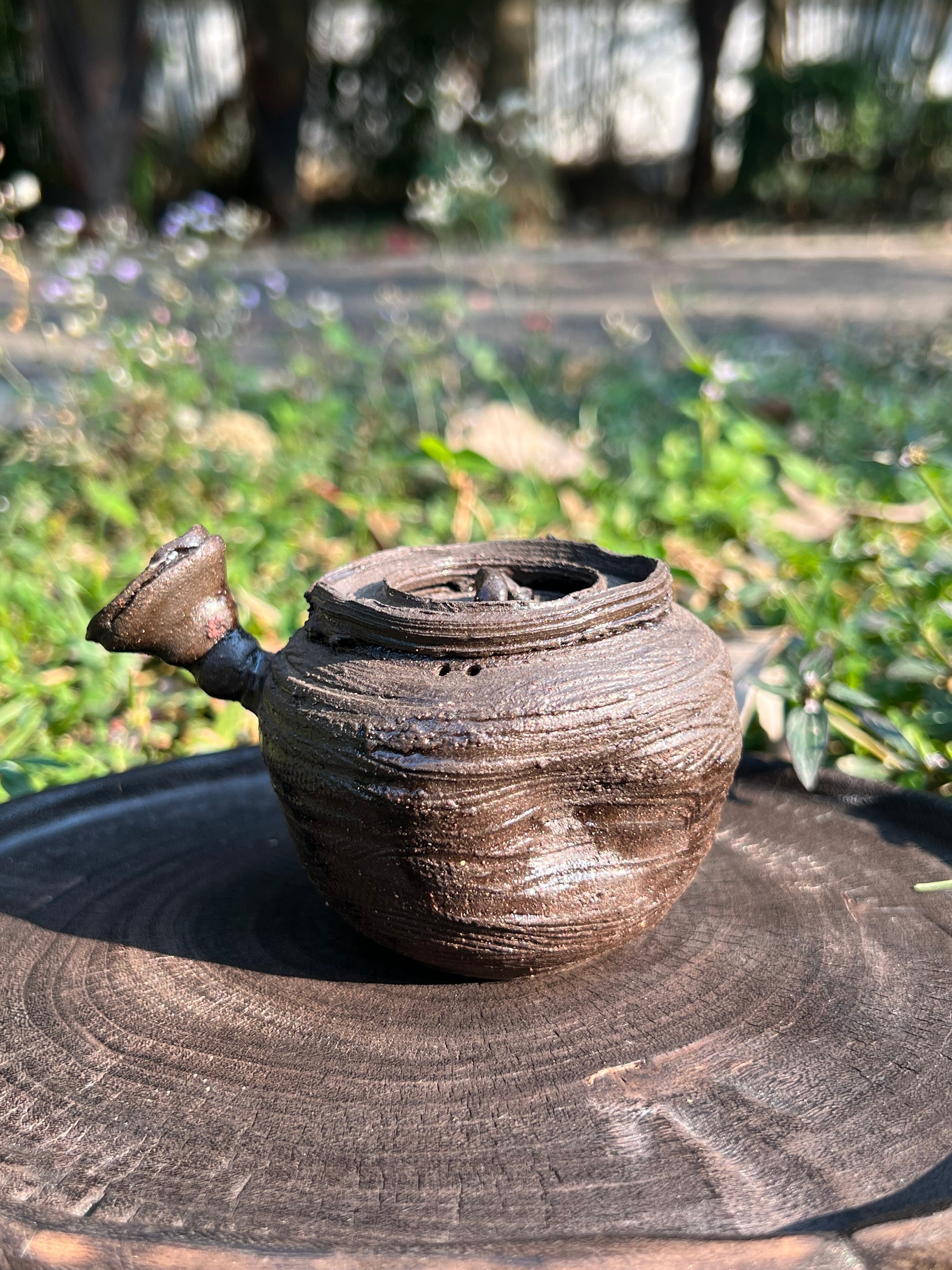 This is a purple clay teapot