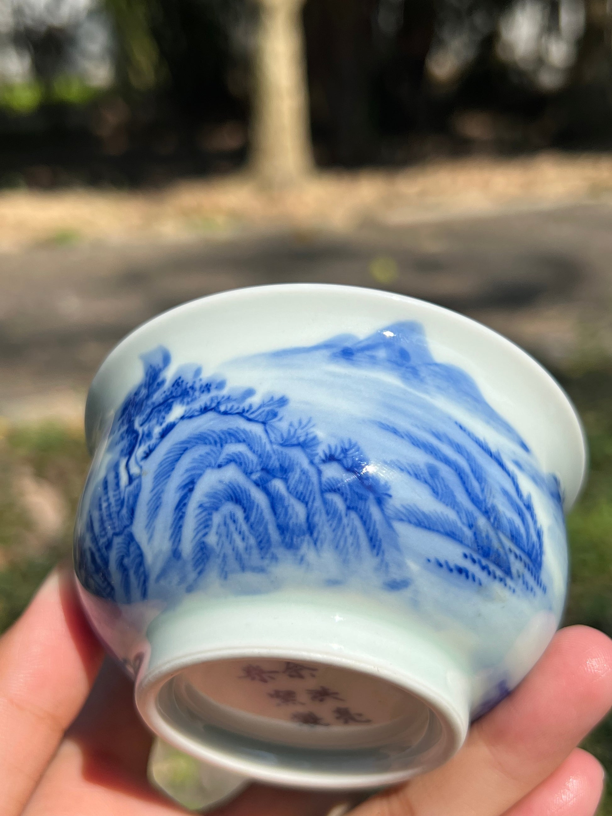 This is a Chinese Jingdezhen blue and white porcelain landscape teacup