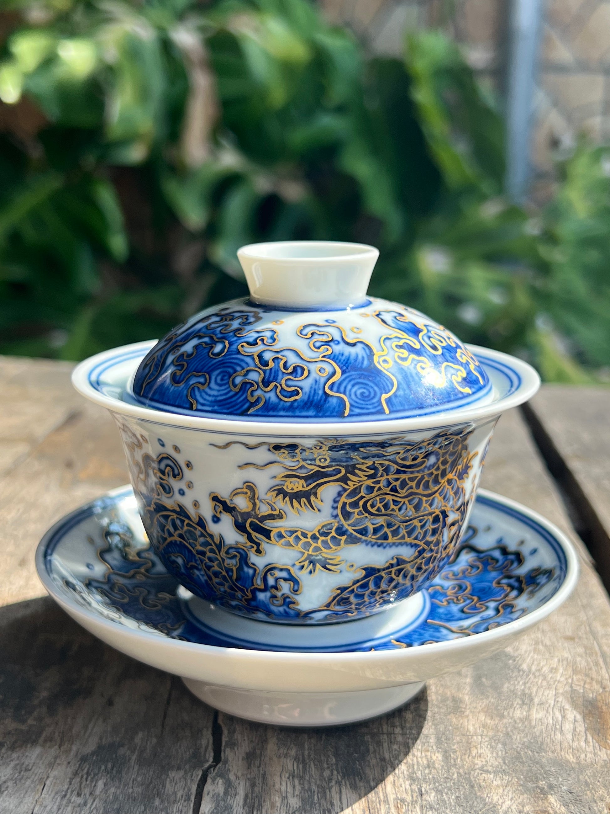 This is a Chinese Jingdezhen blue and white porcelain dragon teapot gaiwan