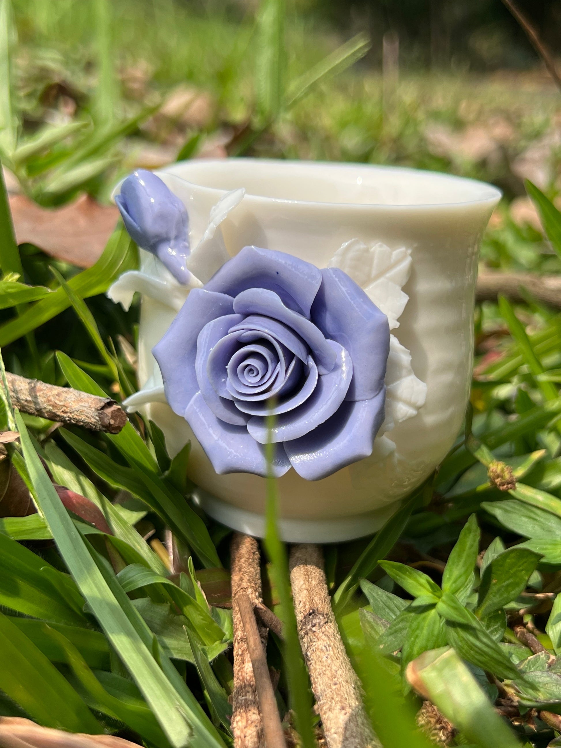 this is a woodfired white fine pottery flower teacup