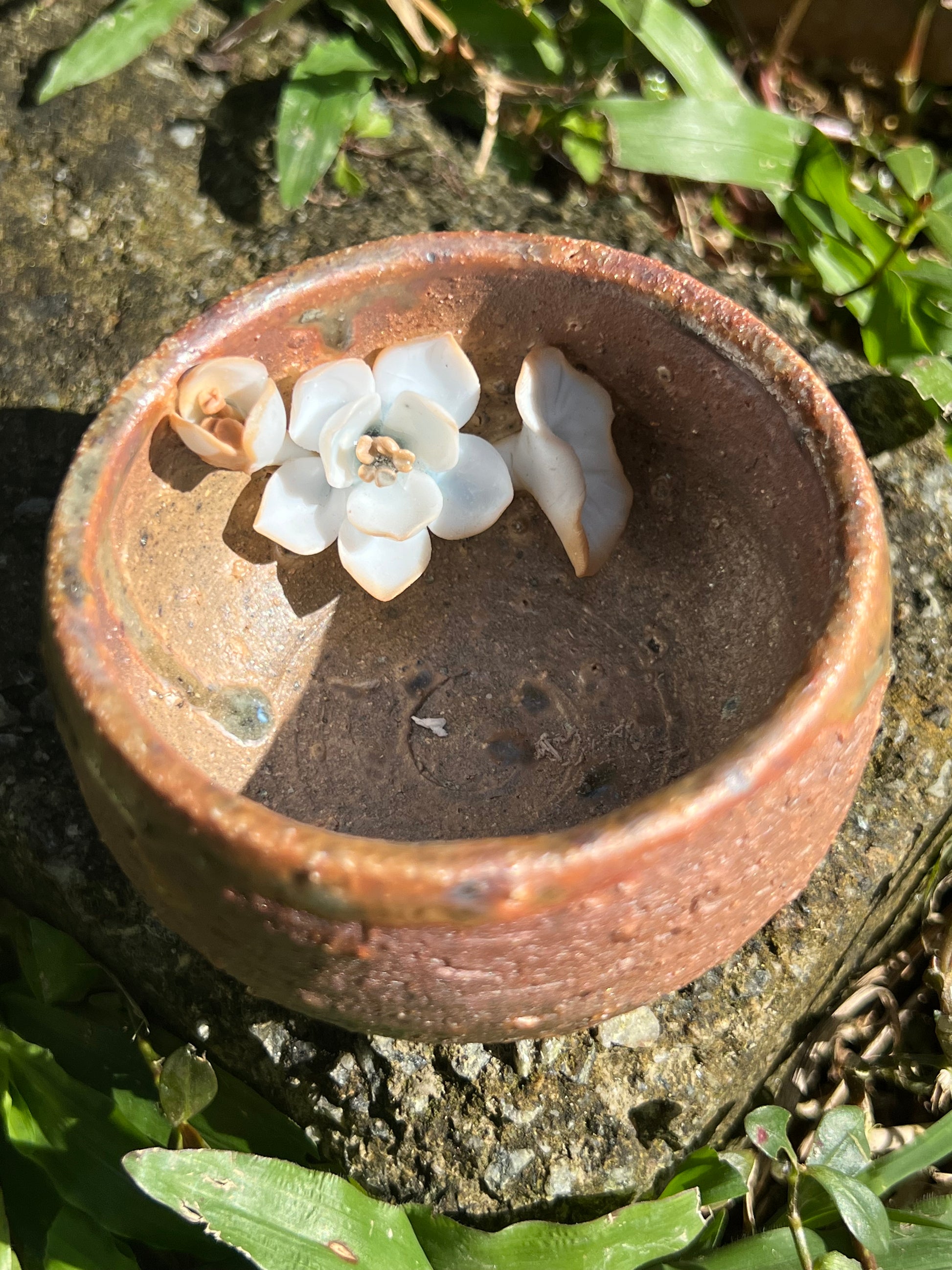 This is a woodfired pottery flower teacup