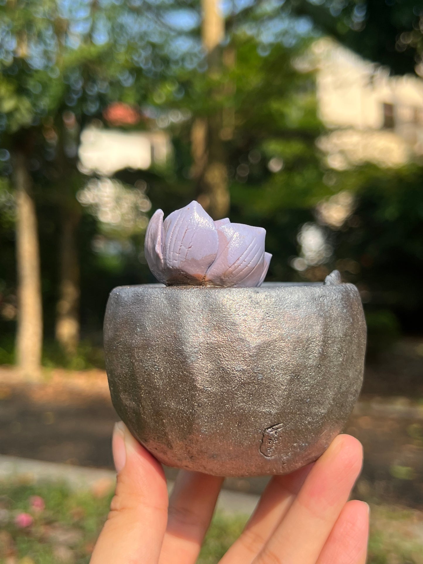 This is a woodfired tietai pottery flower teacup