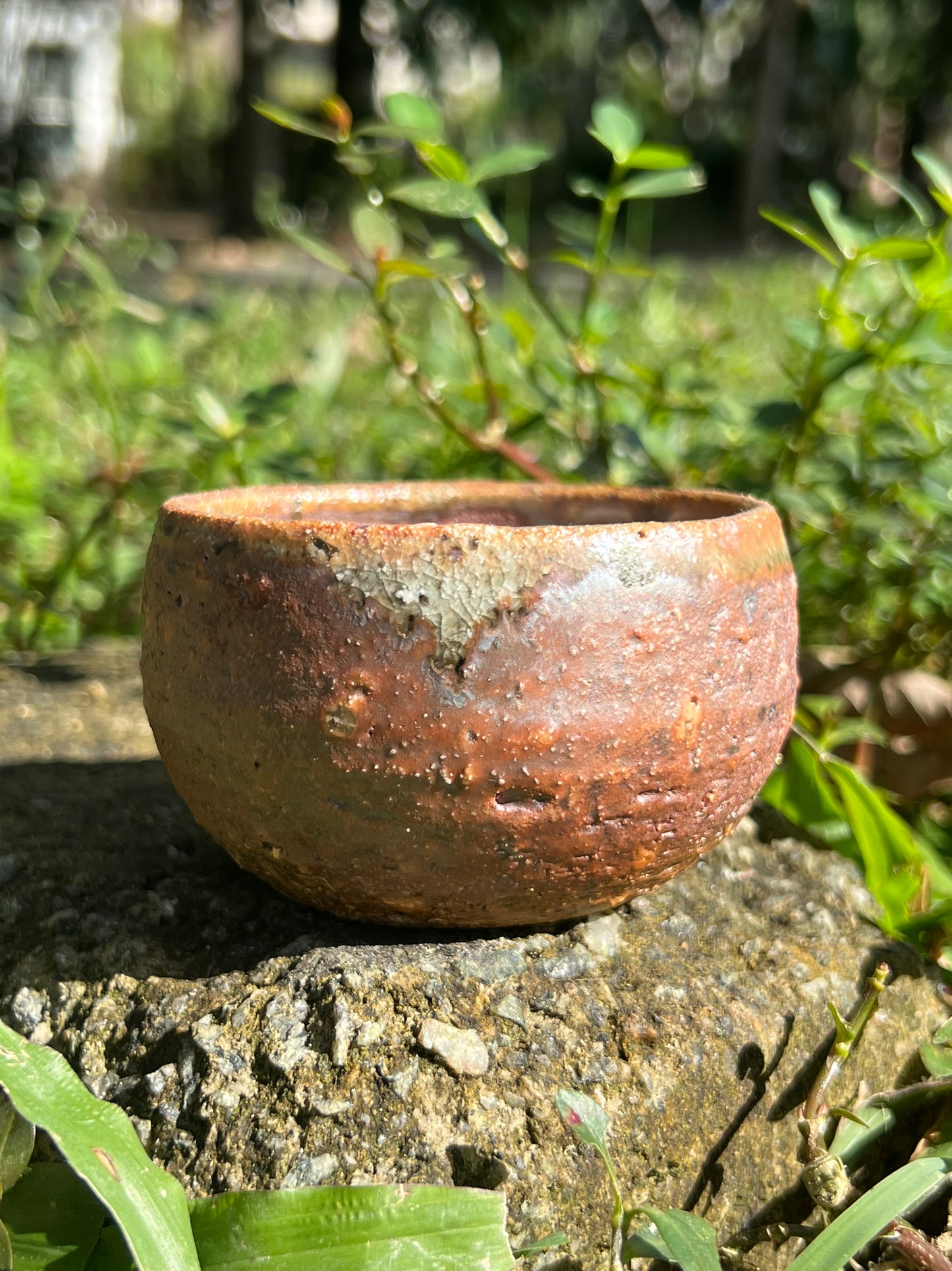 This is a woodfired pottery flower teacup