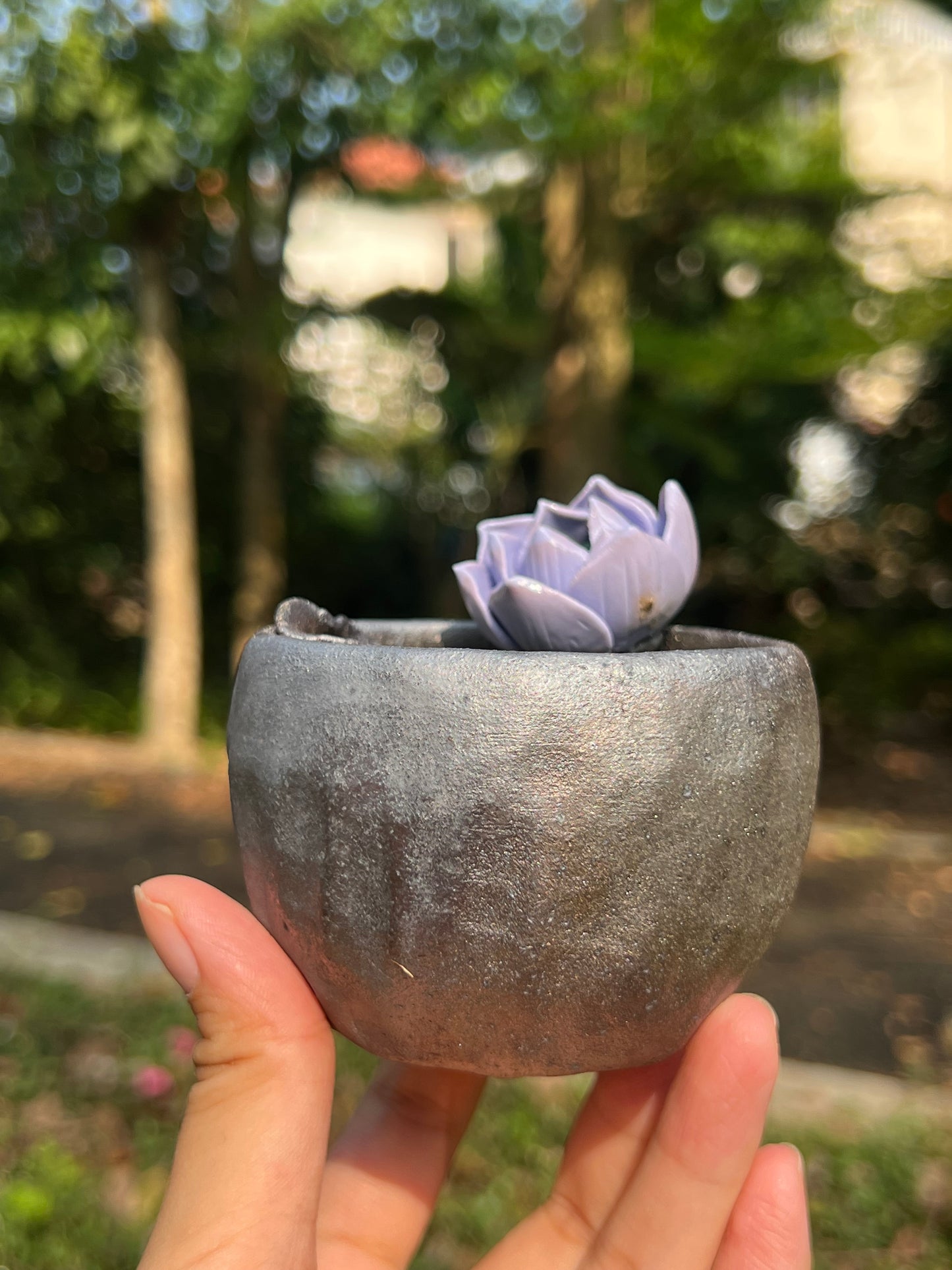 This is a woodfired tietai pottery flower teacup