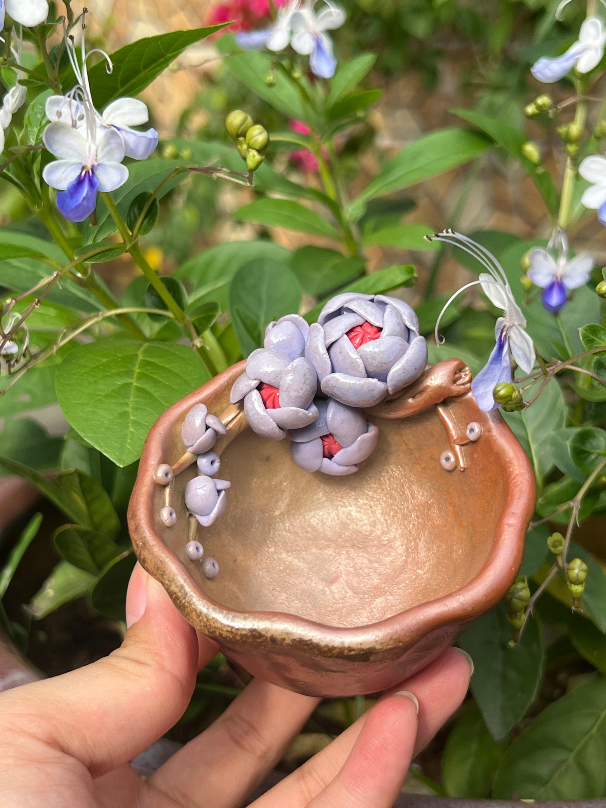 This is a woodfired pottery flower teacup