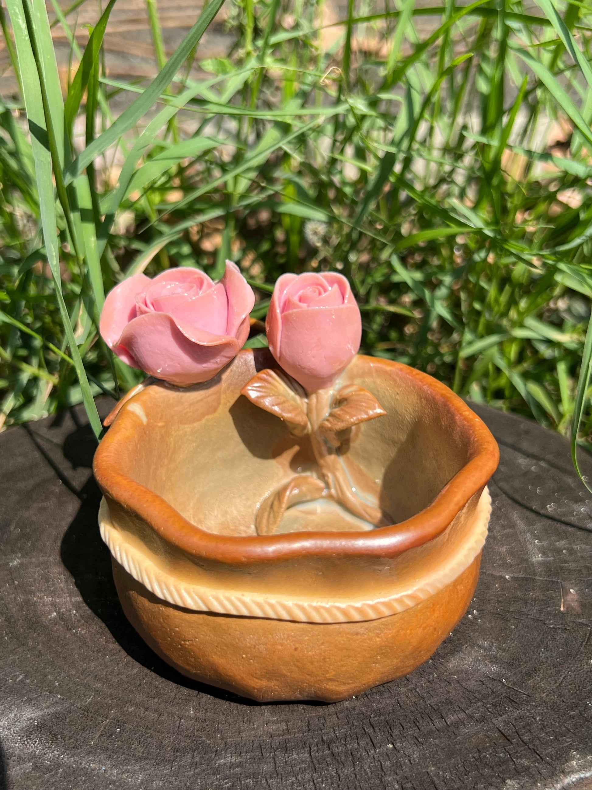 This is a woodfired pottery flower teacup