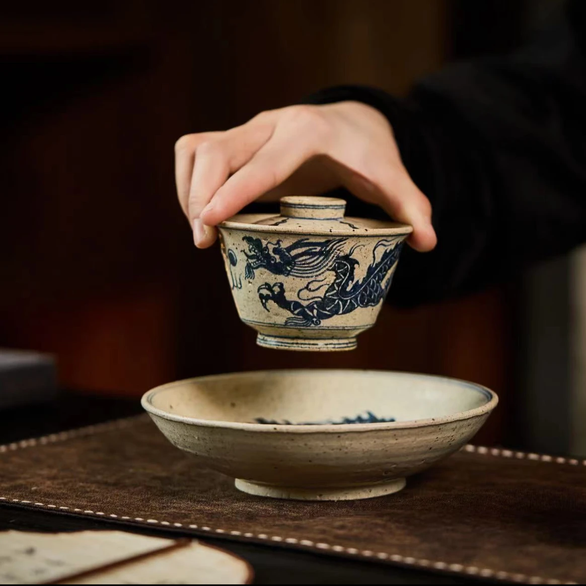 This is a Chinese Jingdezhen blue and white pottery dragon teapot gaiwan