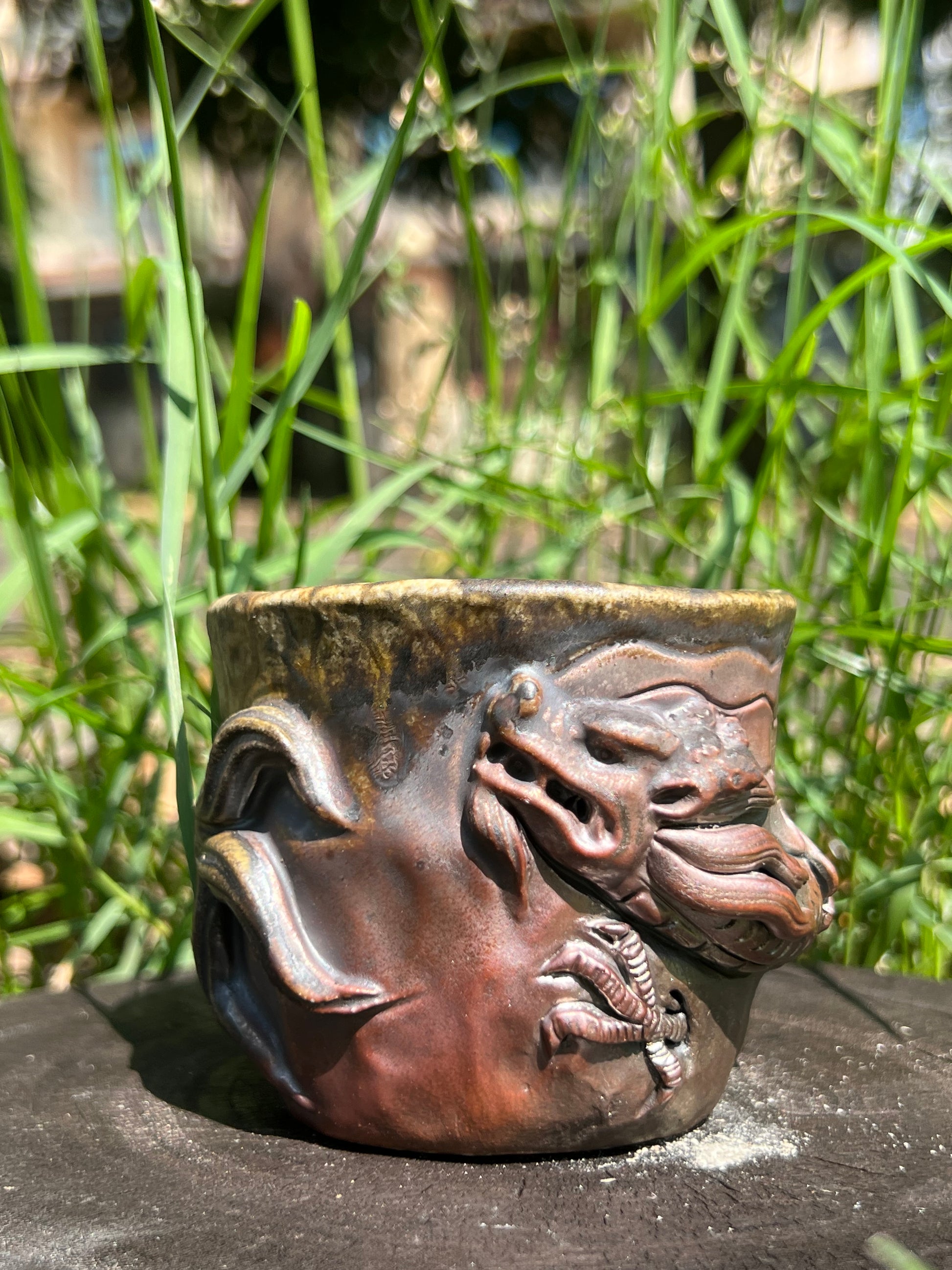 This is a woodfired tietai pottery dragon teacup