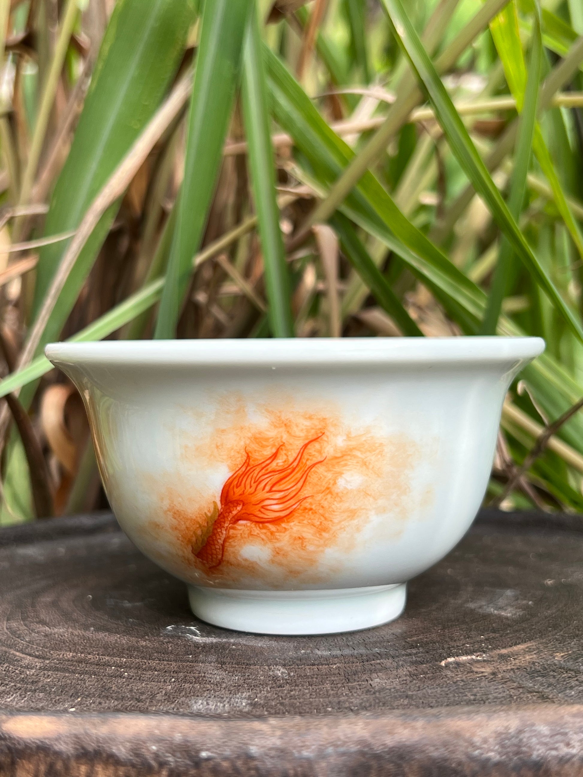 this is a Chinese Jingdezhen alum red dragon phoenix teacup. this is a ceramic teacup