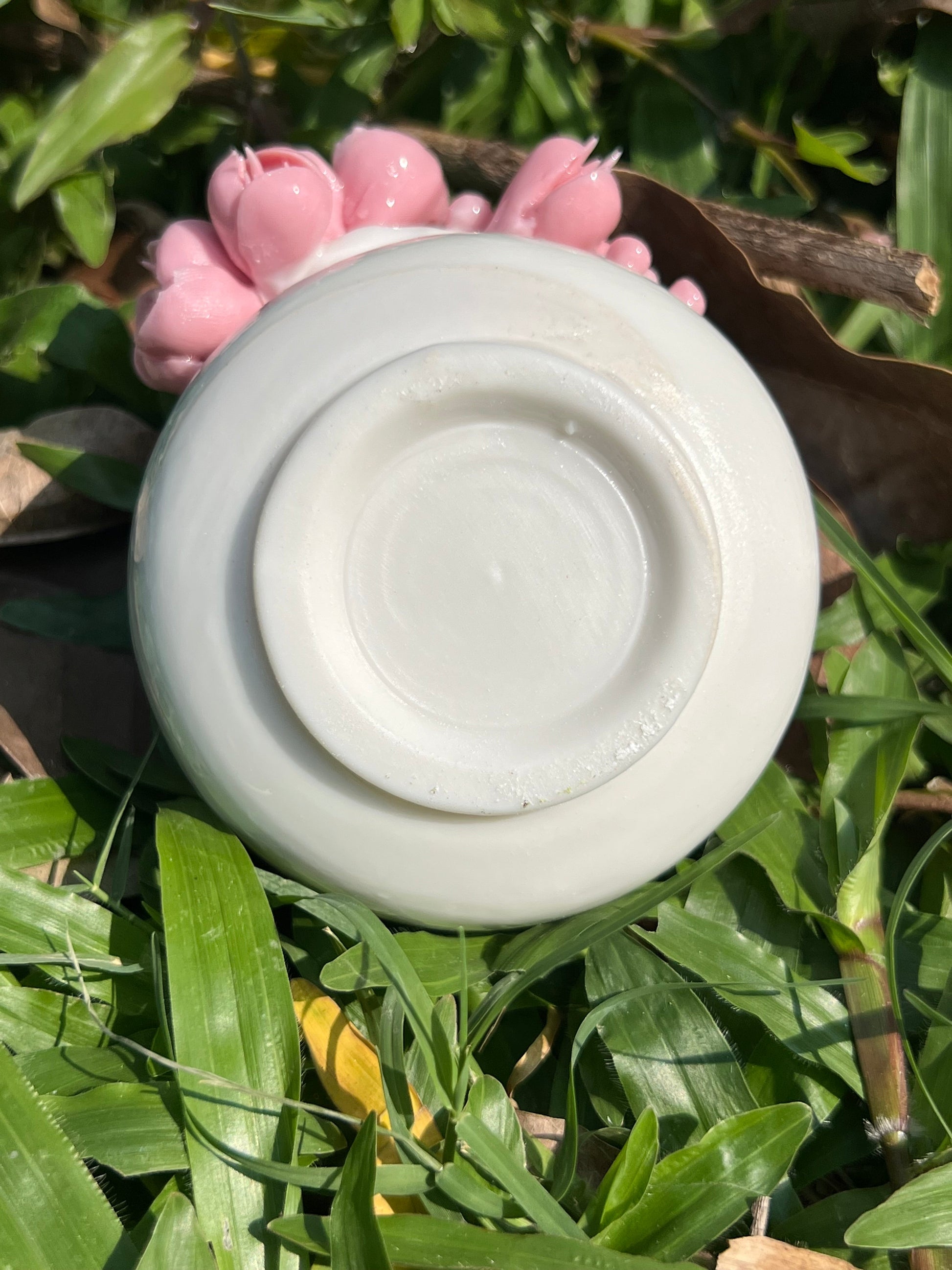 this is a woodfired white fine pottery flower teacup