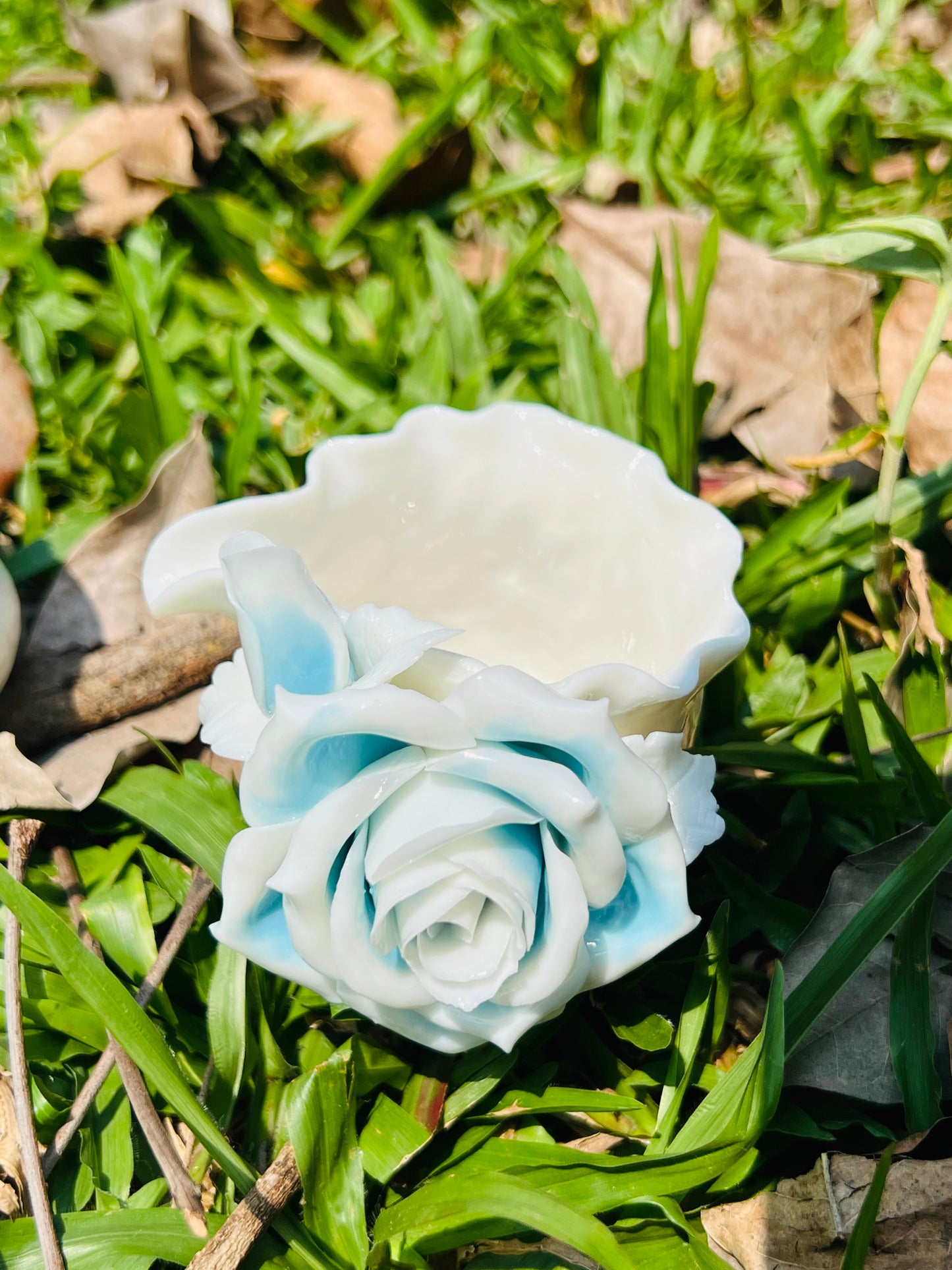 this is a woodfired white fine pottery flower teacup