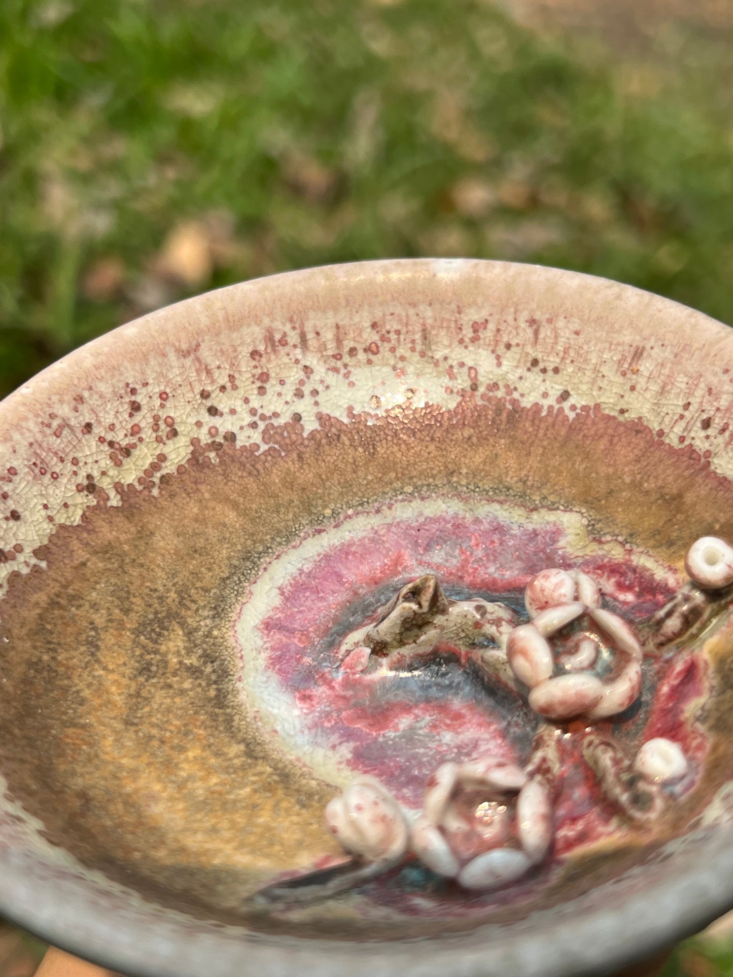 This is a woodfired pottery flower teacup