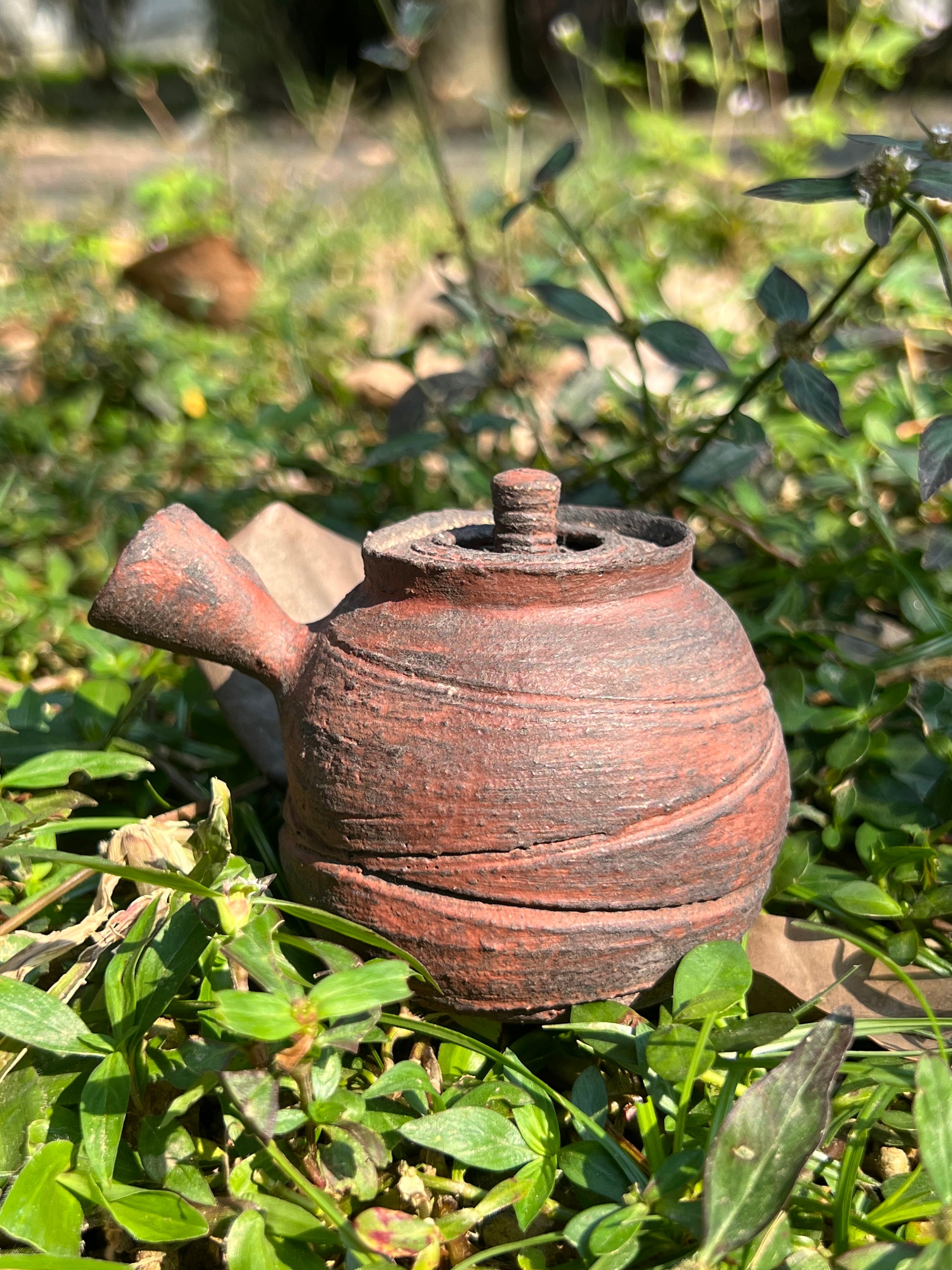 This is a pottery teapot