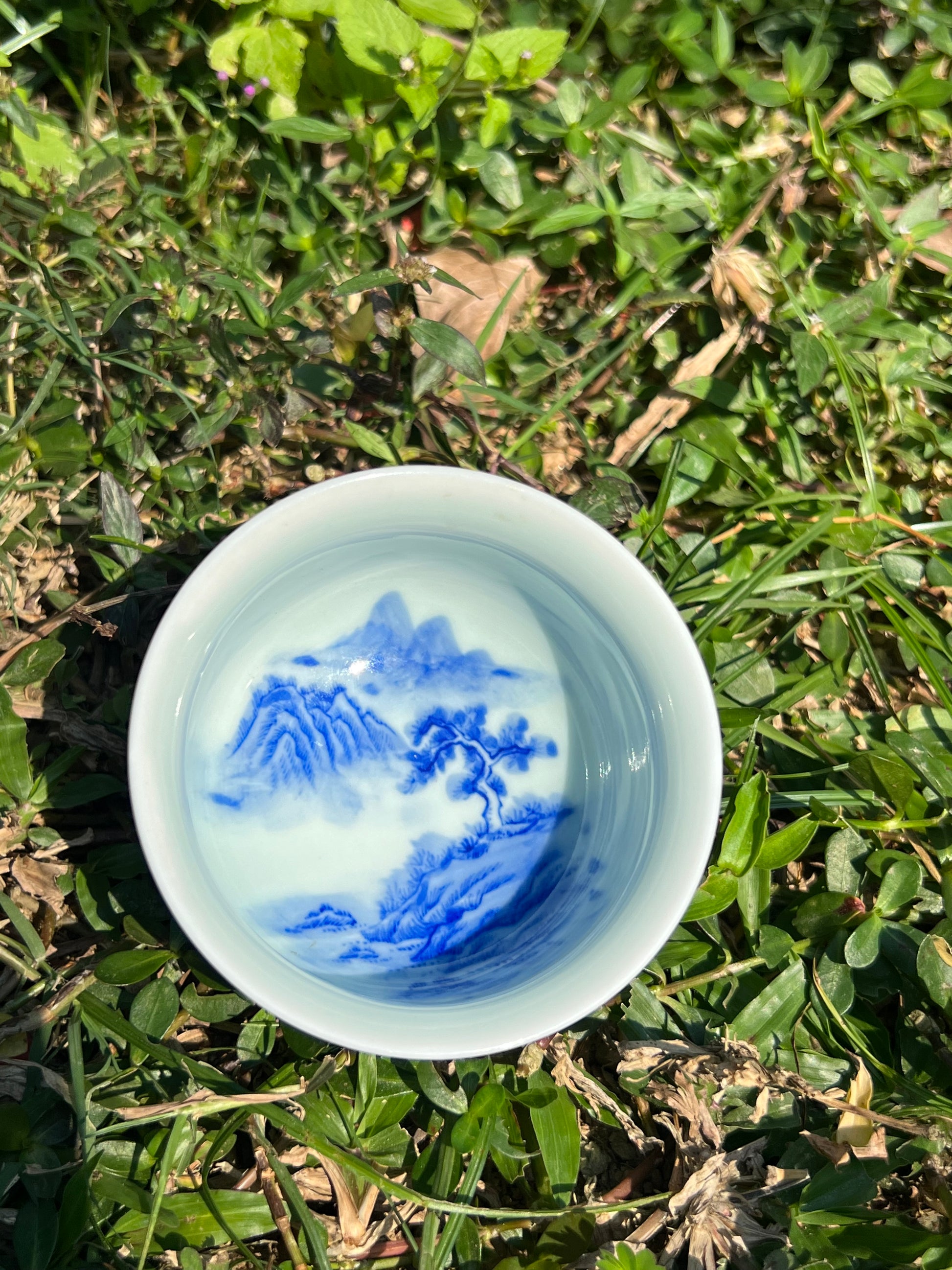 This is a Chinese Jingdezhen blue and white porcelain landscape teacup