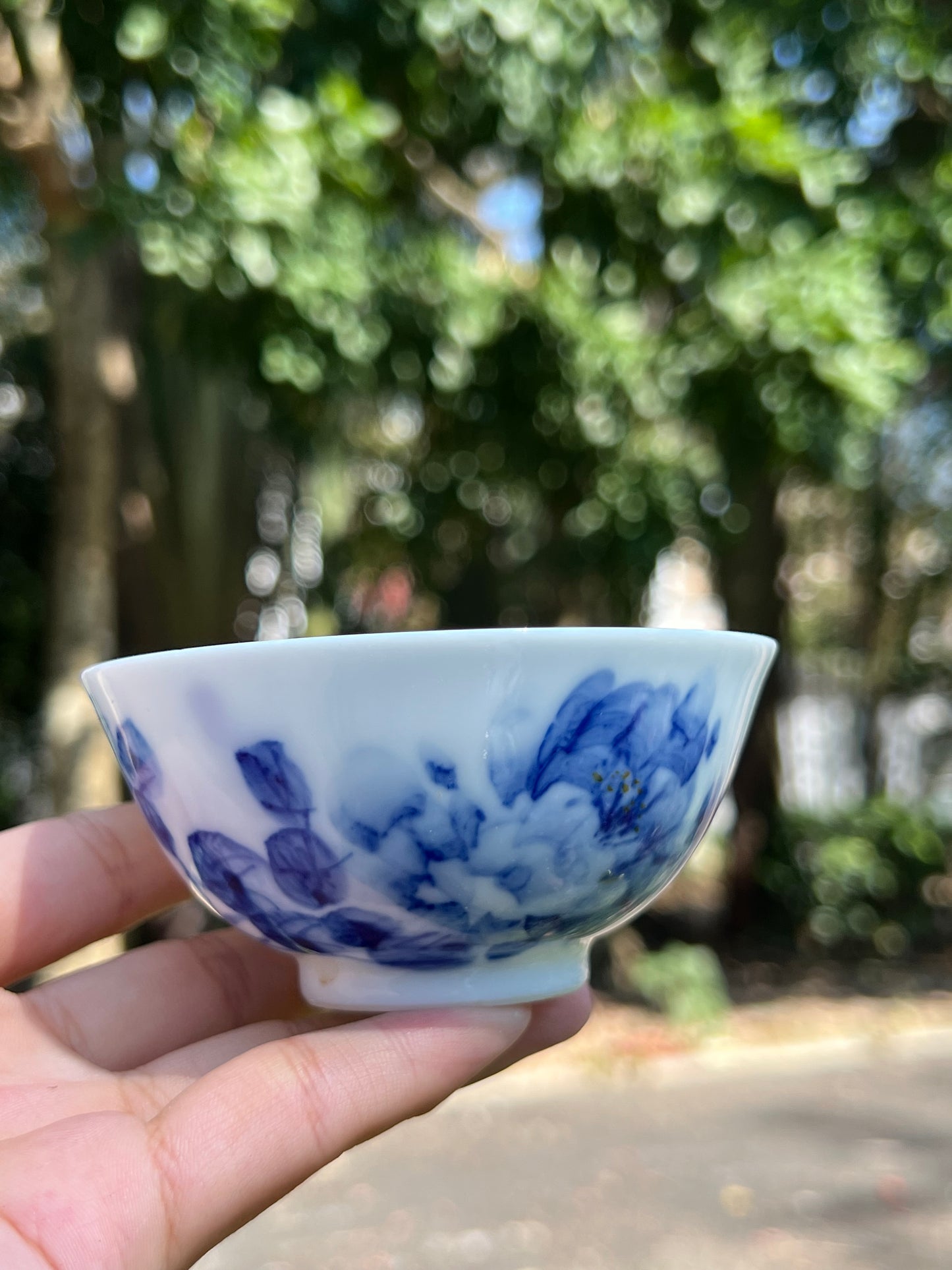 This is a Chinese Jingdezhen blue and white porcelain landscape teacup