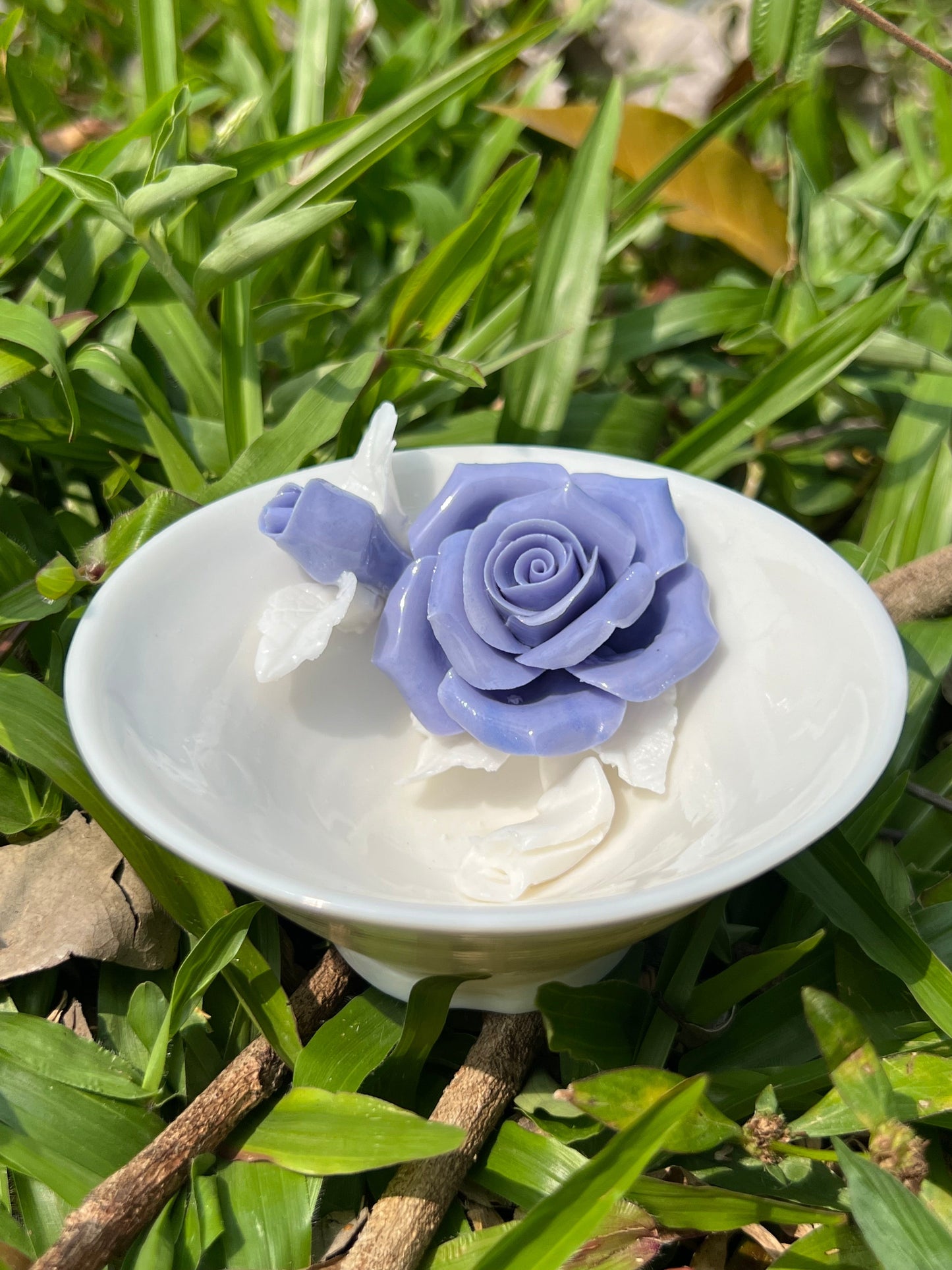 this is a woodfired white fine pottery flower teacup