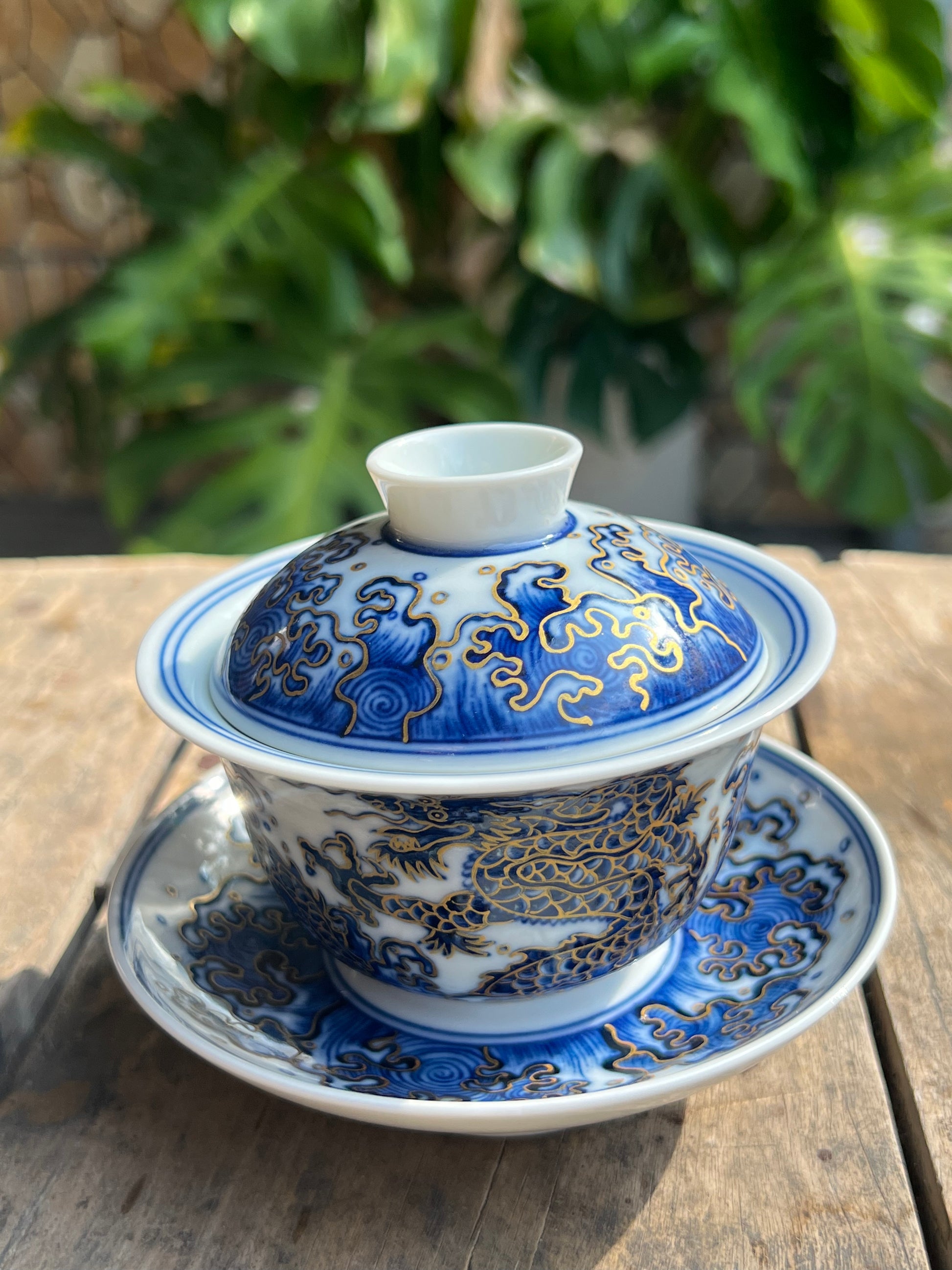 This is a Chinese Jingdezhen blue and white porcelain dragon teapot gaiwan