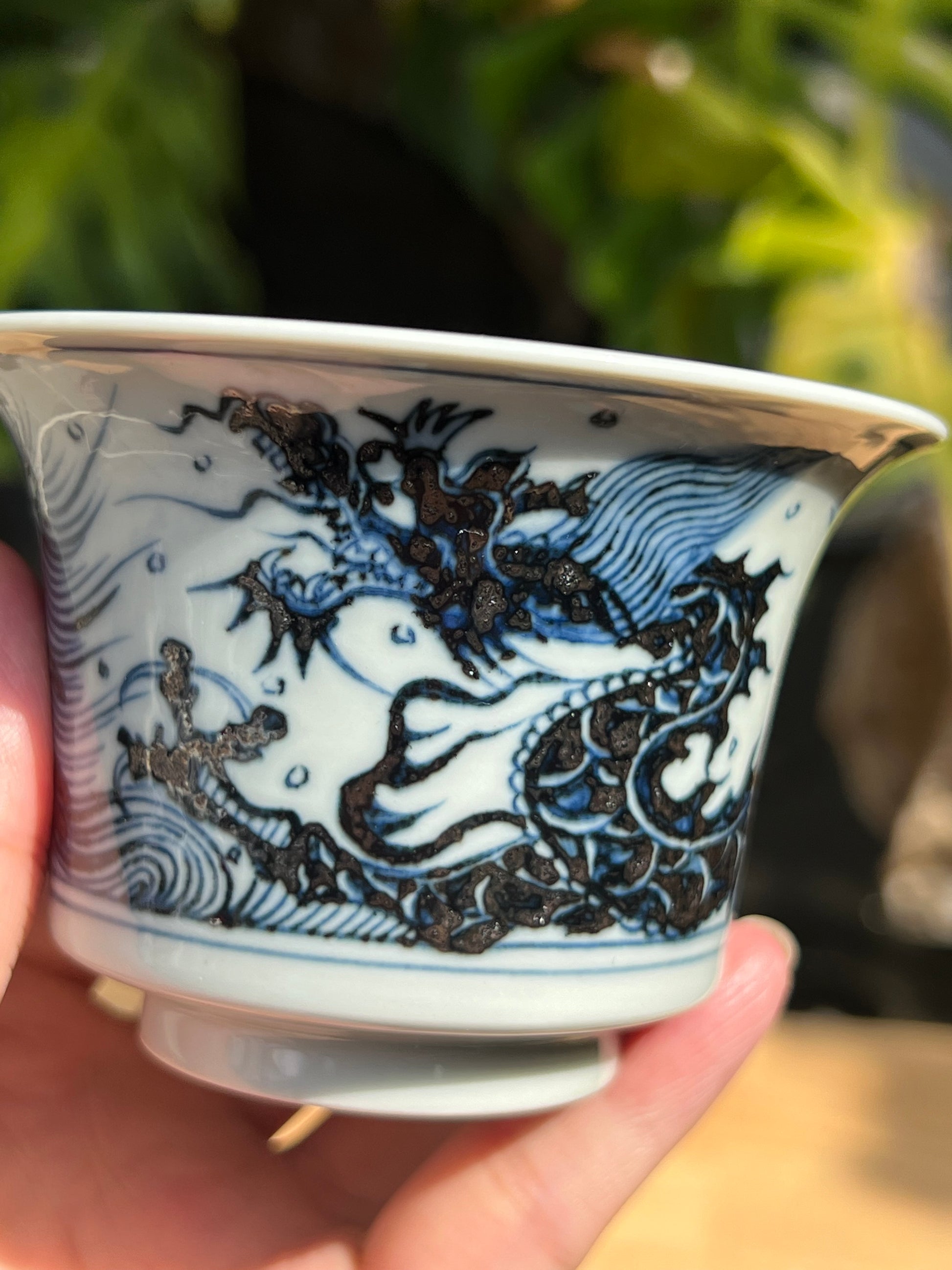 This is a Chinese Jingdezhen blue and white porcelain dragon teapot gaiwan