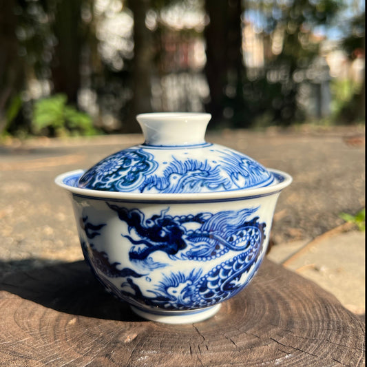 This is a Chinese Jingdezhen blue and white porcelain dragon teapot gaiwan