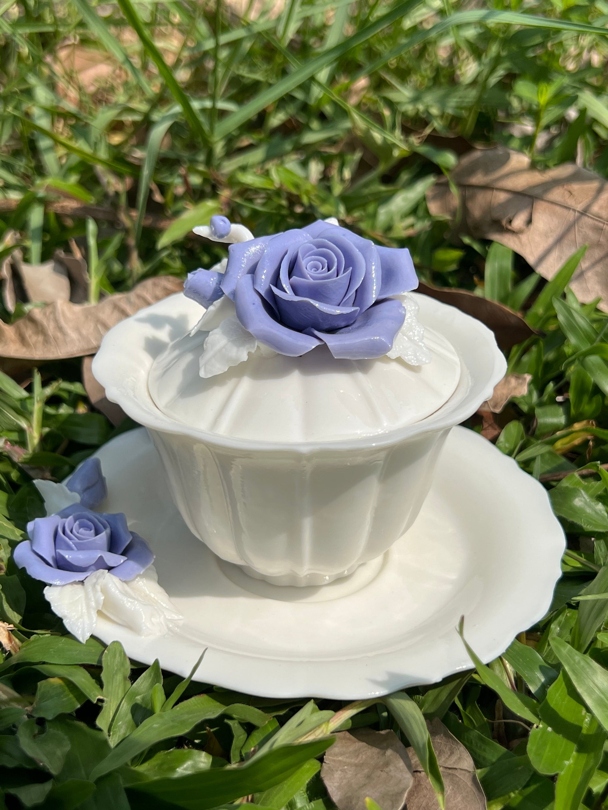 this is a woodfired white fine pottery flower teacup