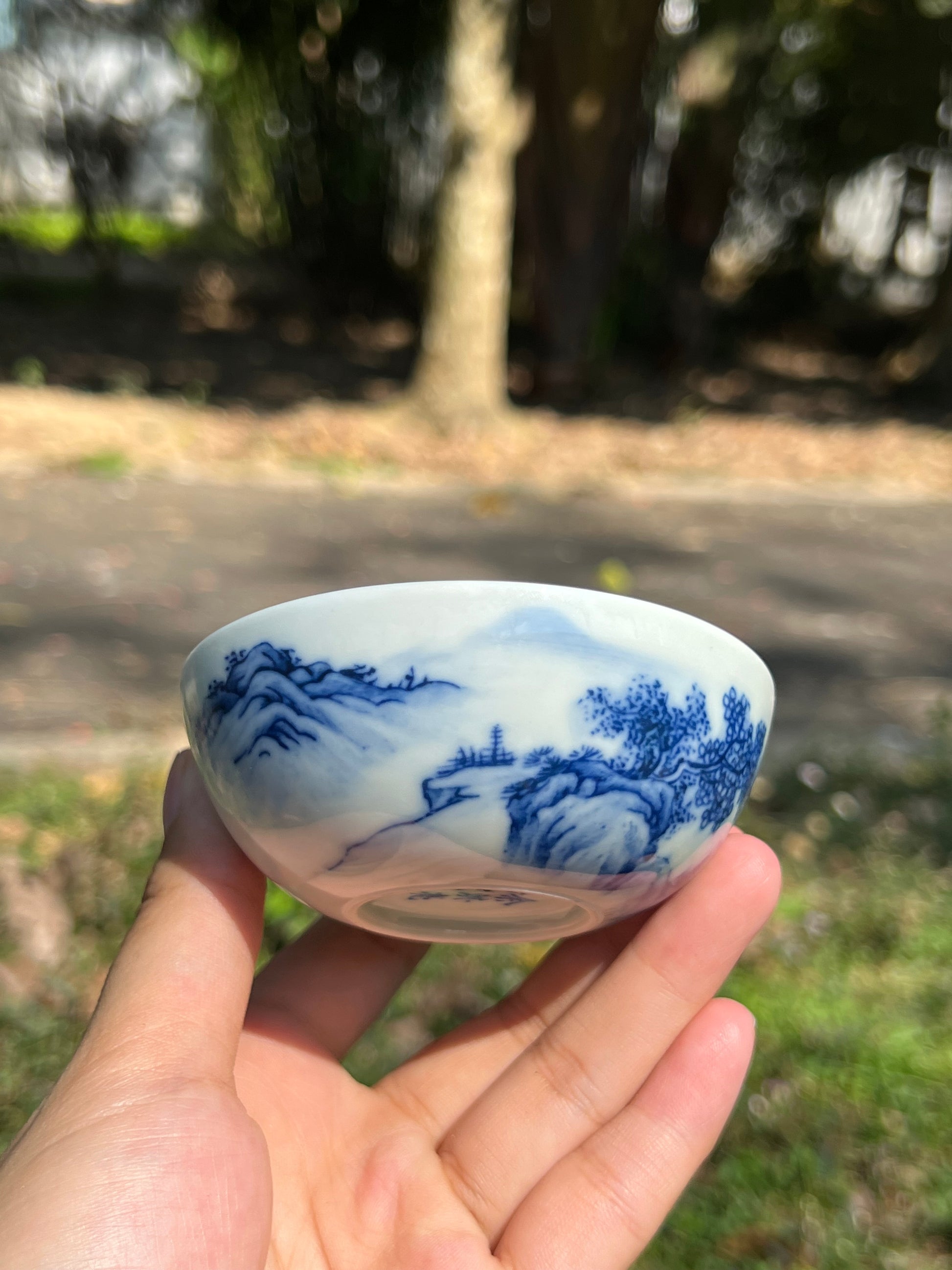 This is a Chinese Jingdezhen blue and white porcelain landscape teacup