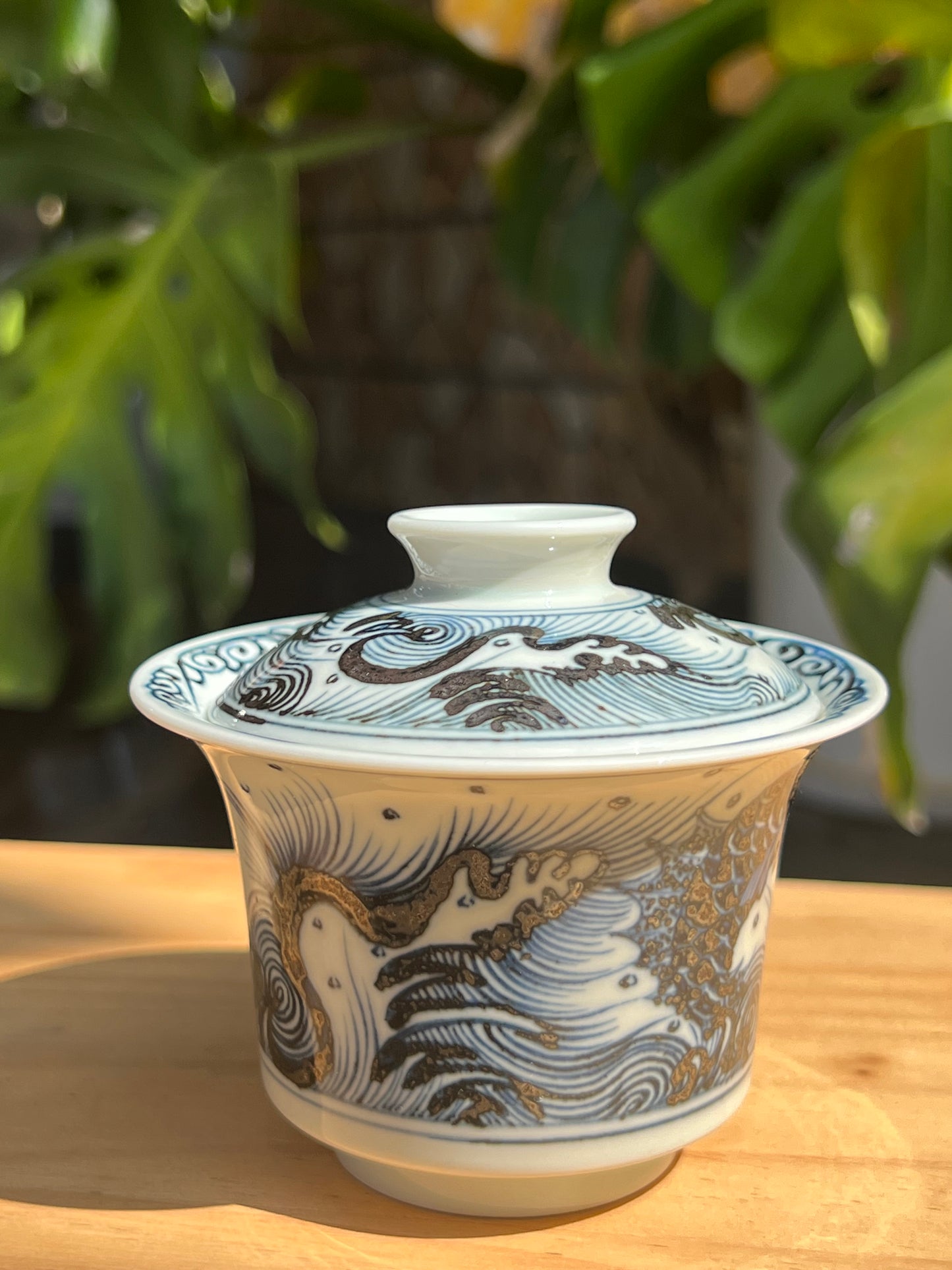 This is a Chinese Jingdezhen blue and white porcelain dragon teapot gaiwan